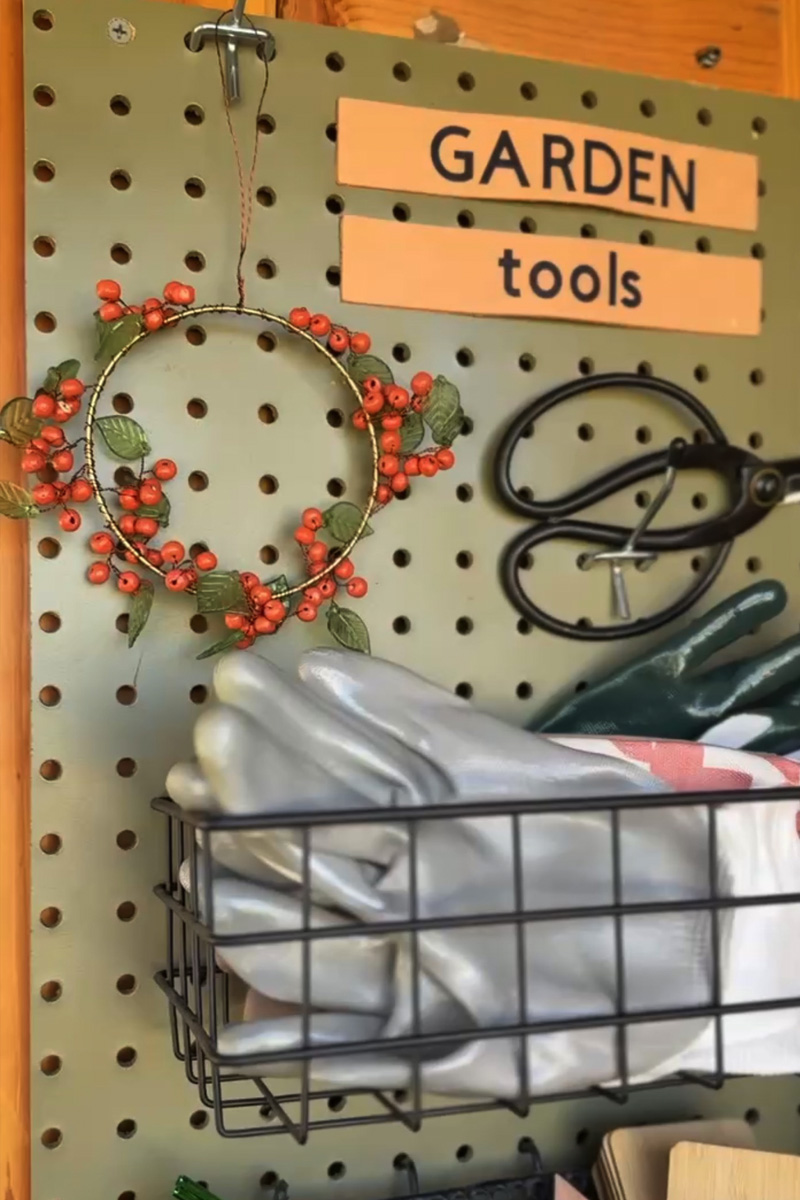 Clean Garden Tools pegboard and bead wreath