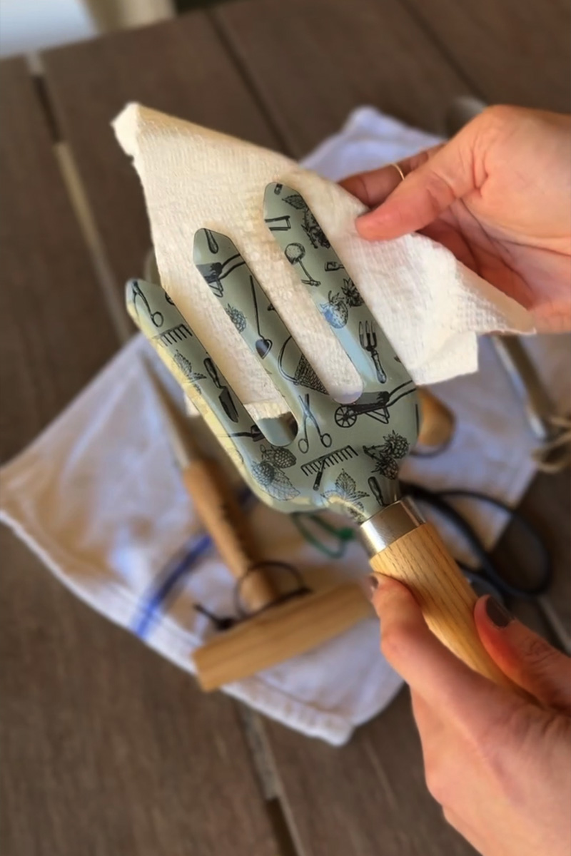 Wipe down garden fork with a paper towel