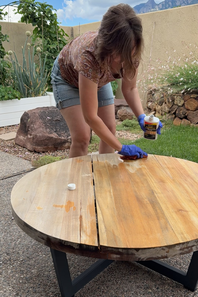 Apply teak brightener to outdoor table