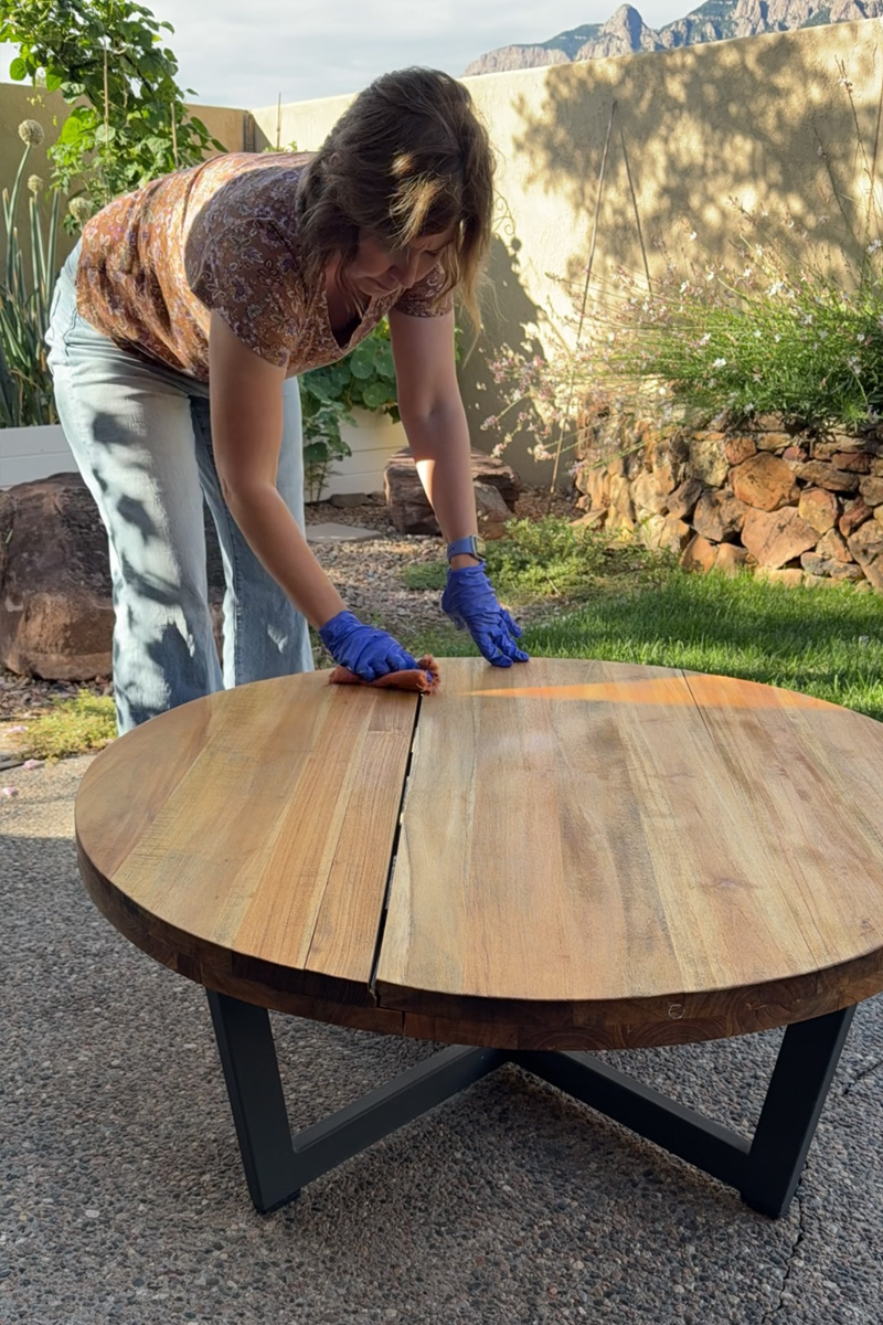 Wipe excess teak oil off table