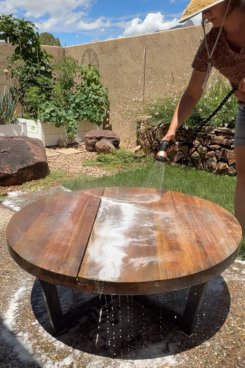 Rinsing a teak outdoor furniture table