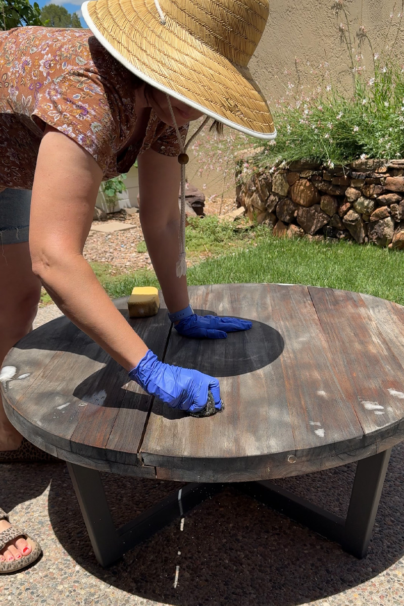 Scrub a teak table clean