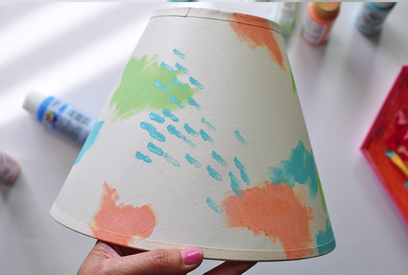Adding blue paint to a lamp shade