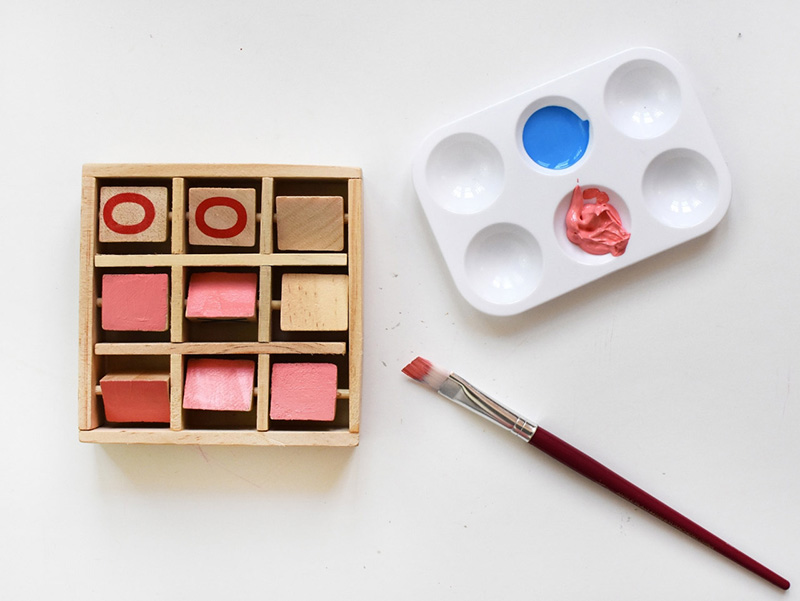 Pink paint on wooden squares