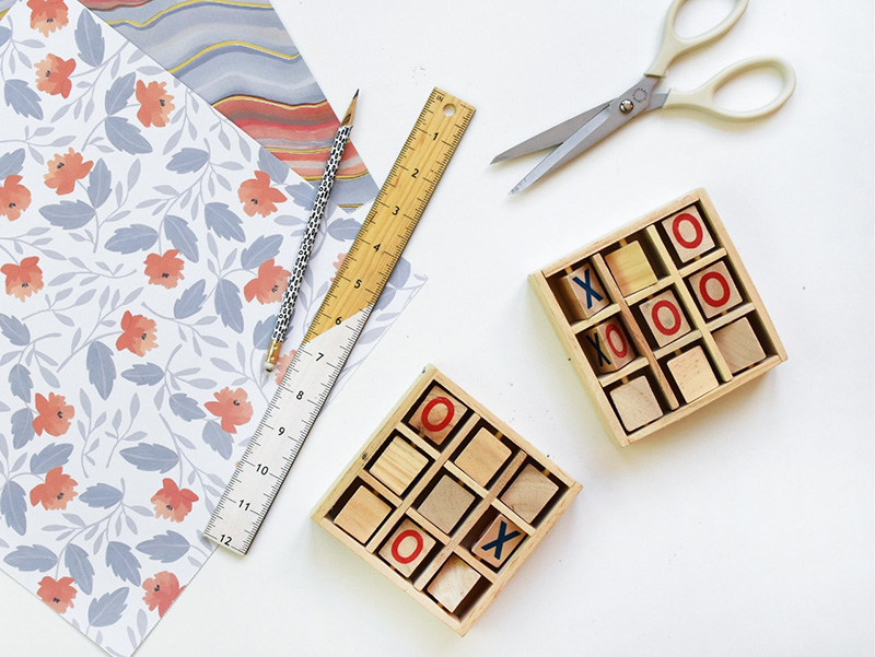Scrapbook paper and scissors cut for wooden game