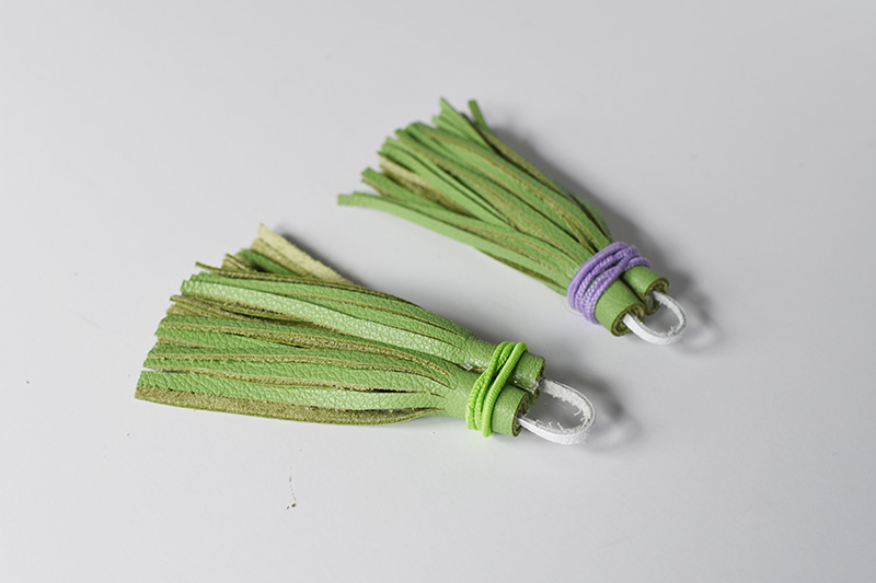 Rolled green leather tassels