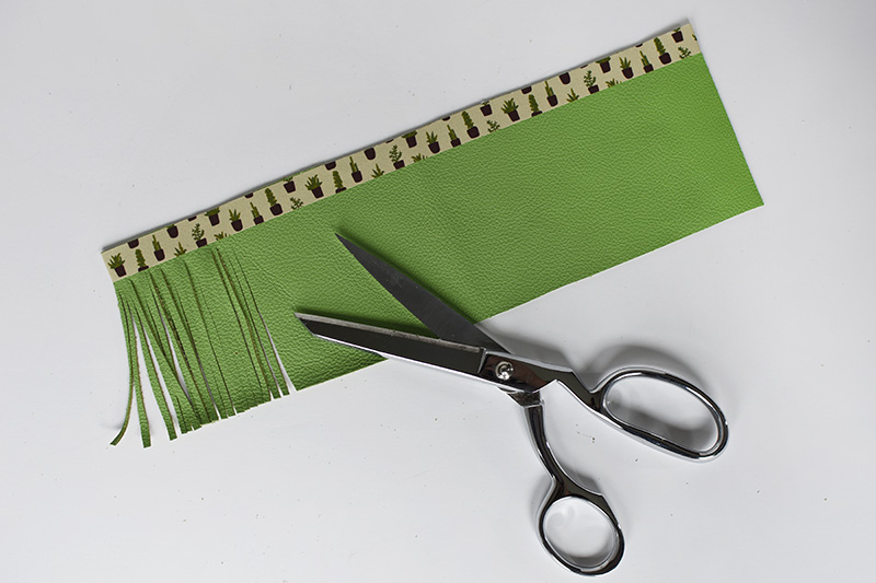Cutting green leather into strands
