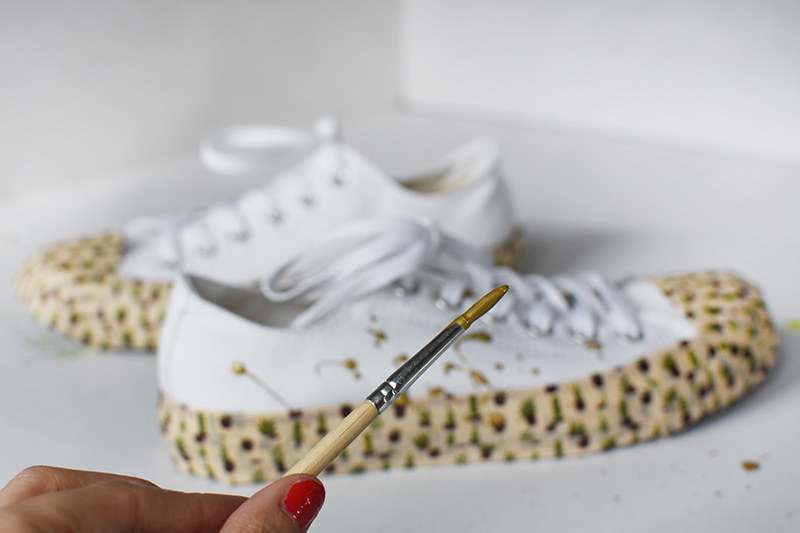 Gold Paint splatter on white shoes