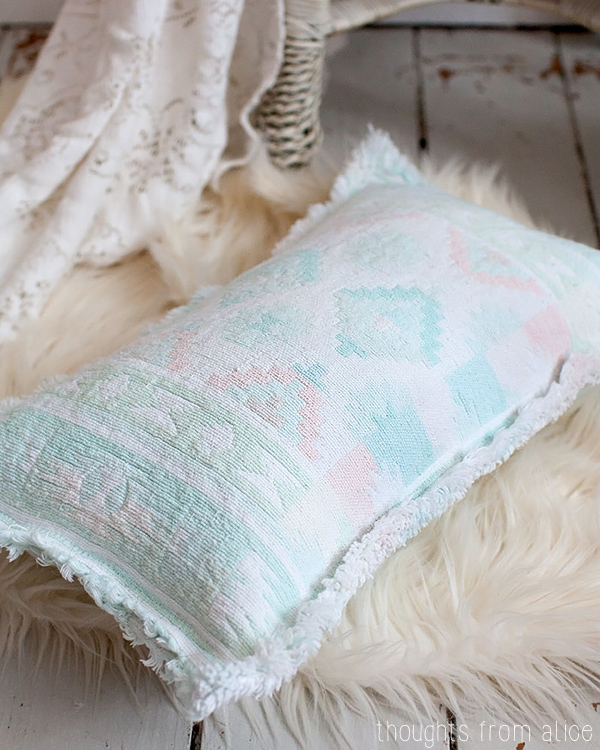 Throw Pillow on white fur rug