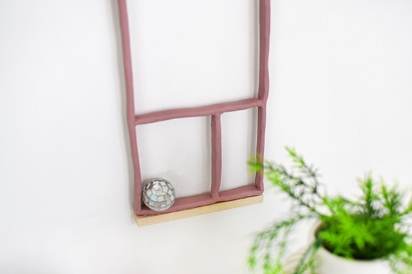 Learn how to make a DIY Clay Shadowbox to hang in your home on the wall. Delineate Your Dwelling #DIYShadowbox #WallHanging #Shadowbox #claycraft