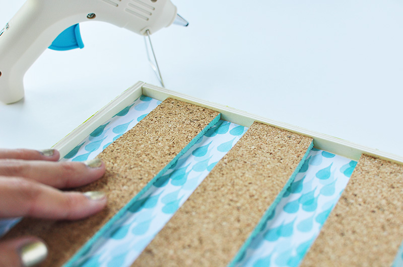 Hot glue cork to a wooden board