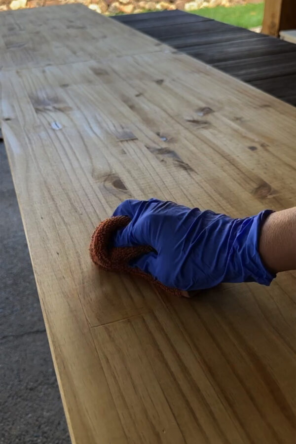Rubbing down wood stain with a rag