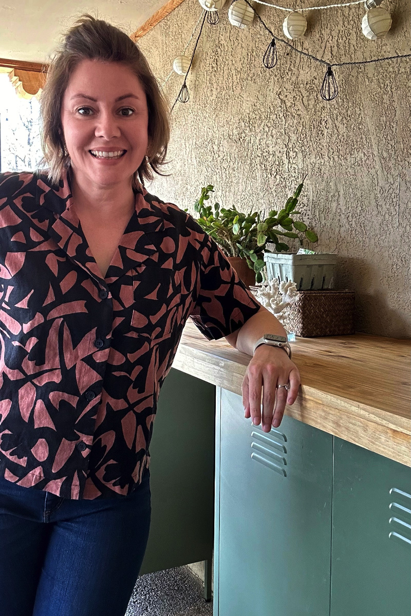 Woman leaning against DIY bartop