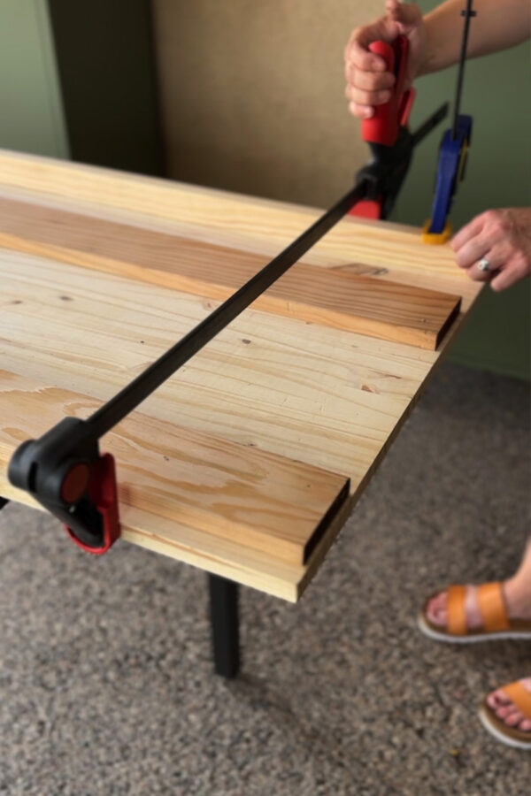 Securing trim with clamps