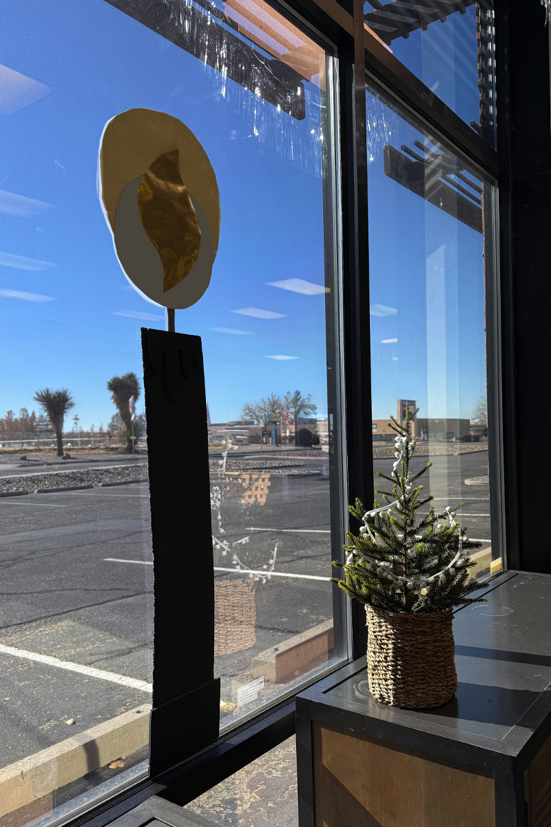 Large craft candle in window