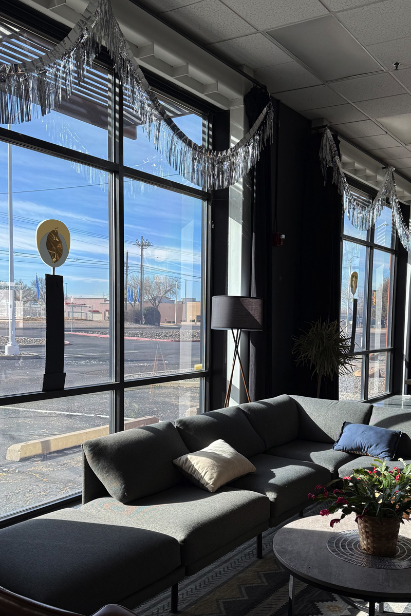 Large crafted candles in windows