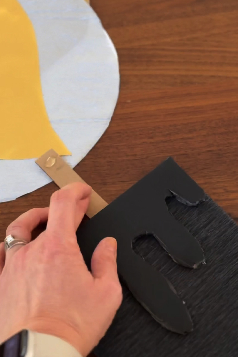 Adding a wick to a paper candle