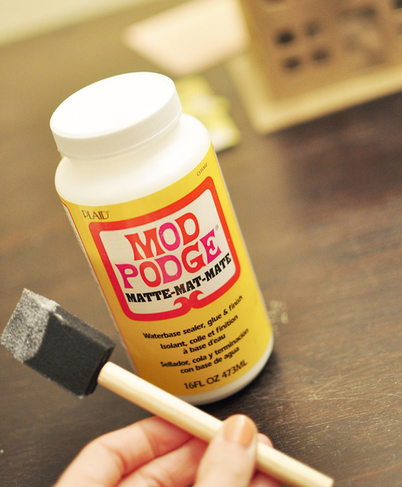 DIY-Scrapbook-Paper- Doll house applying mod-podge glue