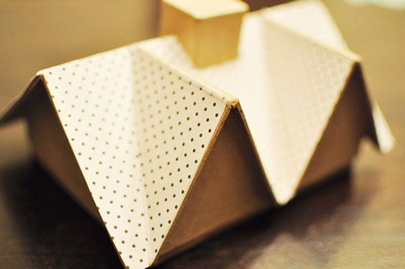 Black and white polka dot paper on doll house roof