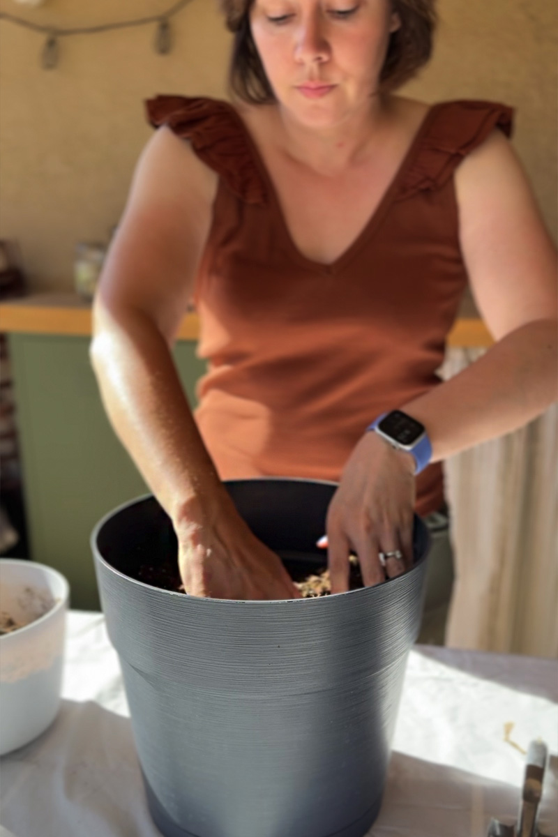 Filling pot with soil 