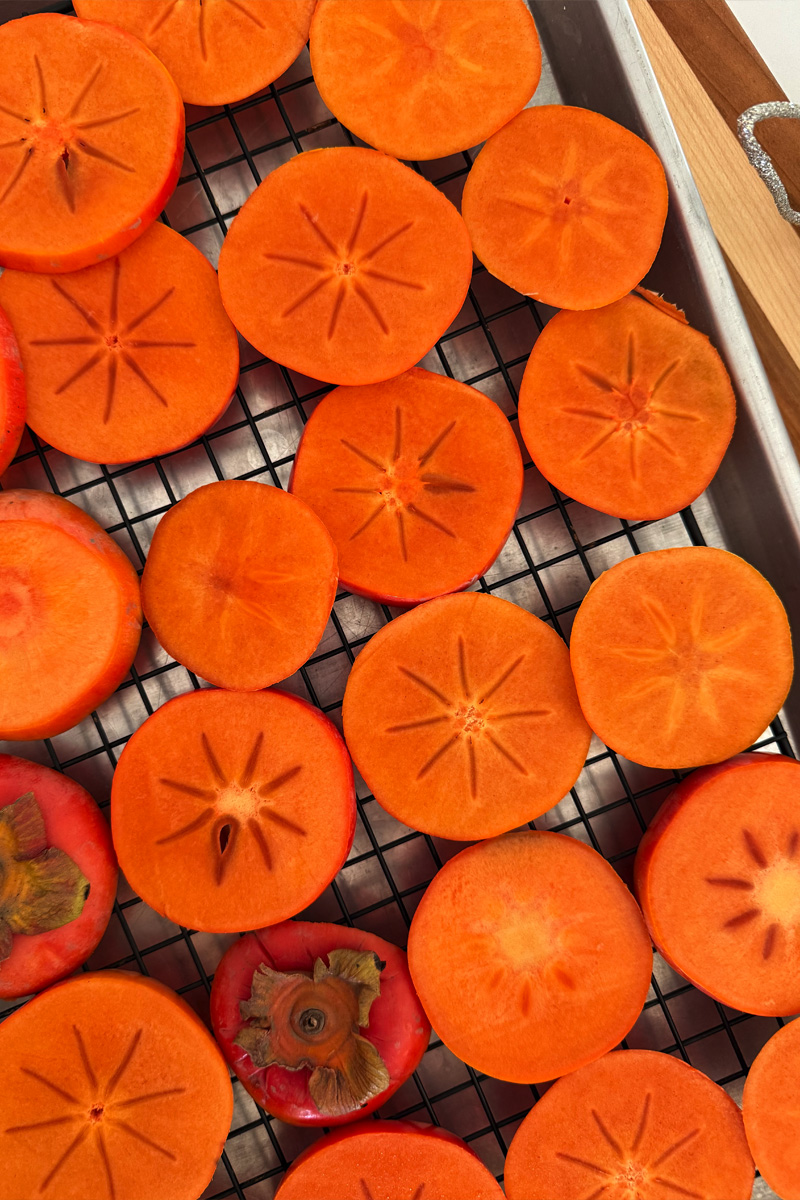 Cut persimmon on a drying rack
