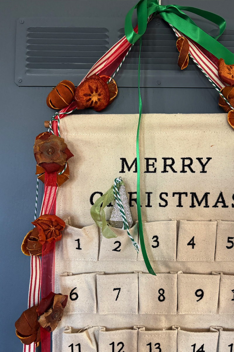 Dried Holiday fruit strung over Advent Calendar