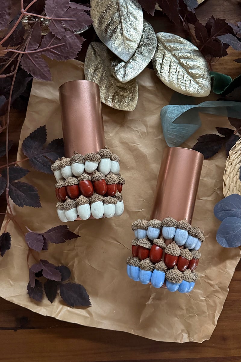 Blue, red and white acorns on a fall centerpiece