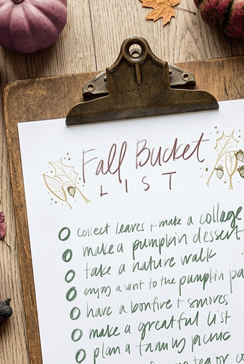 Free Autumn colored fall activity list on an old wooden clipboard