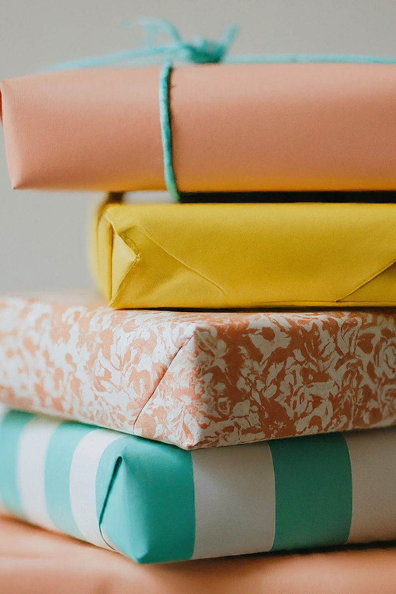 Soft pastel wrapped presents in a pile