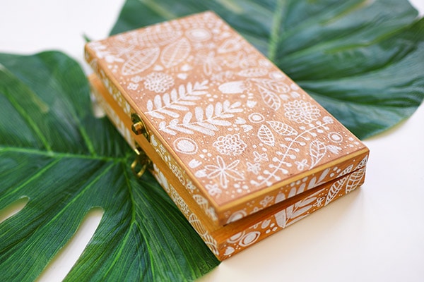 Wooden Box on green leaves