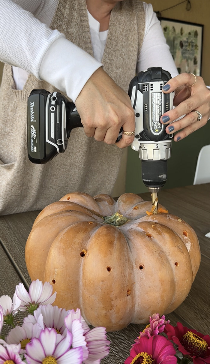 Drilling holes in a pumpkin