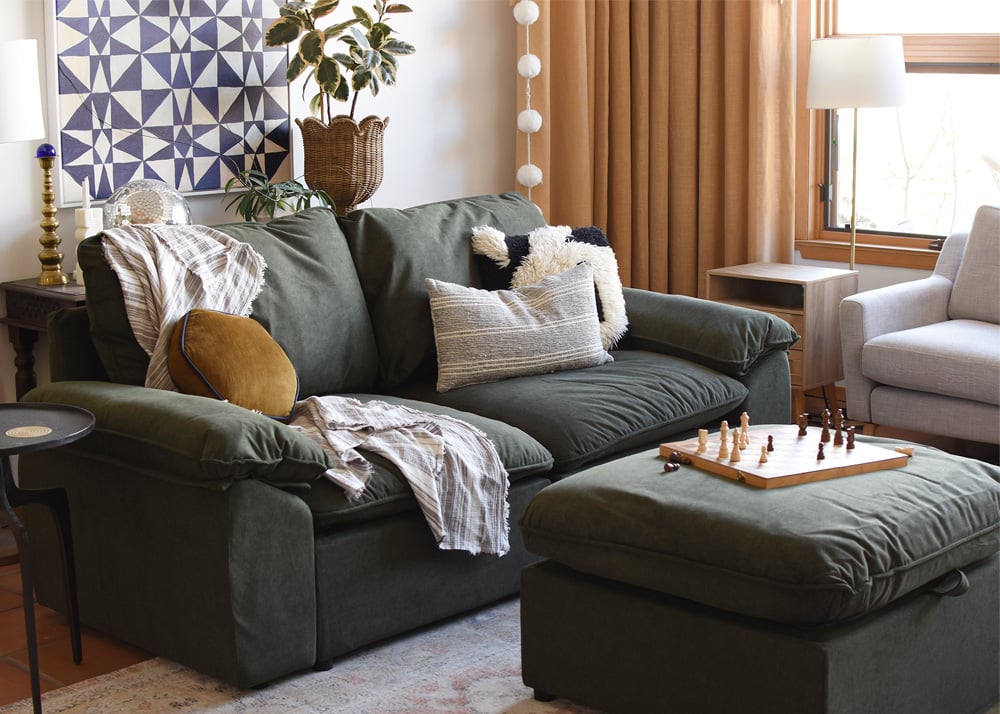 Green loveseat in modern living room
