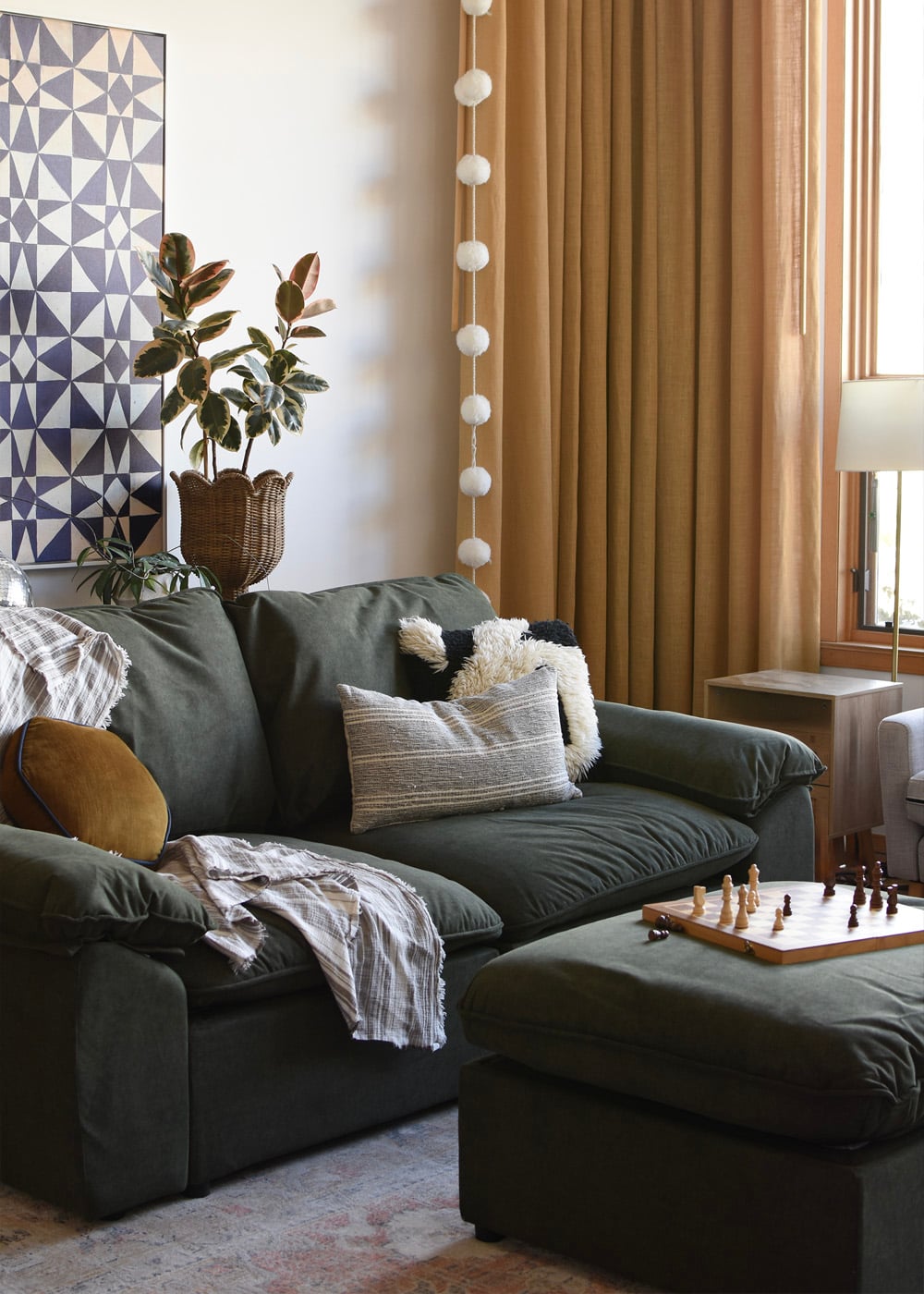 Green Modular Sofa with moveable ottomans in modern living room
