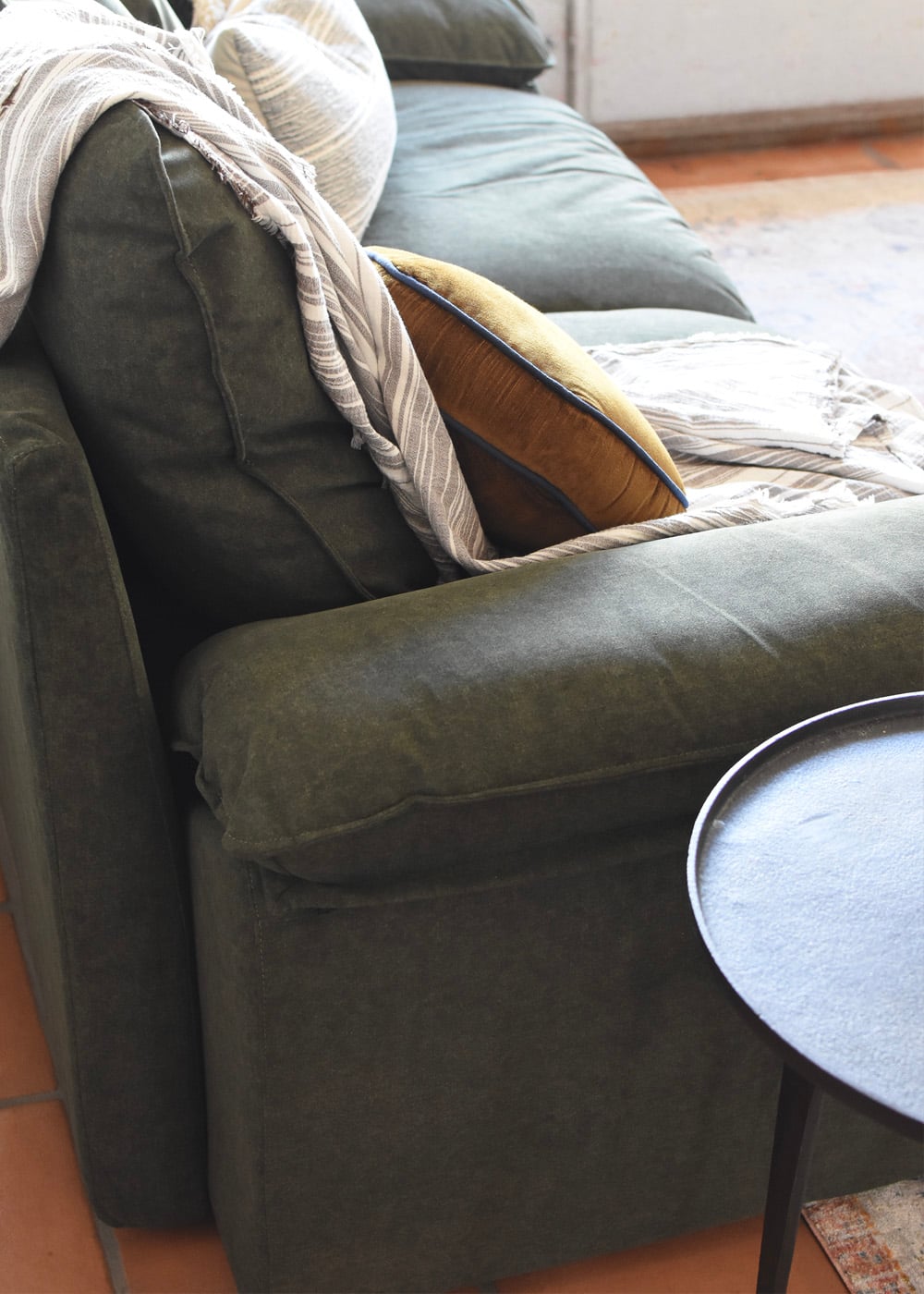Green modular sofa in performance velvet material