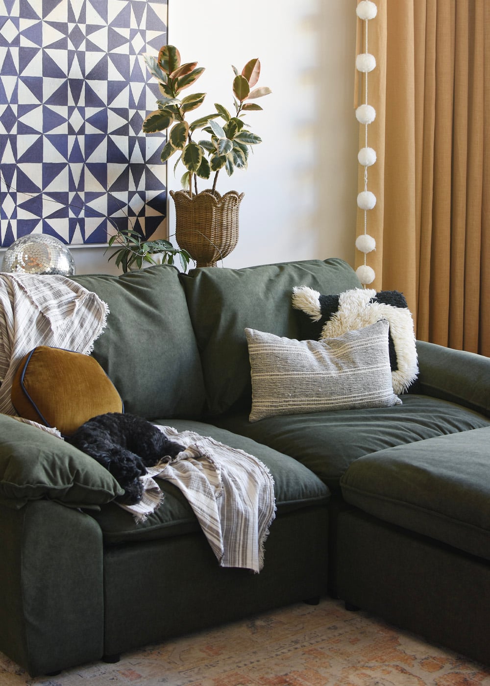 Green L-shaped sectional sofa in living room