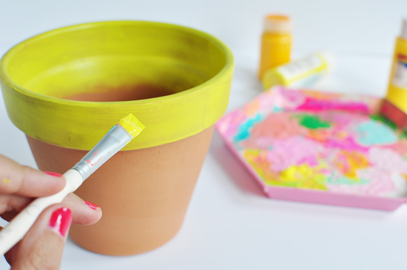 Yellow painted terra cotta pot top