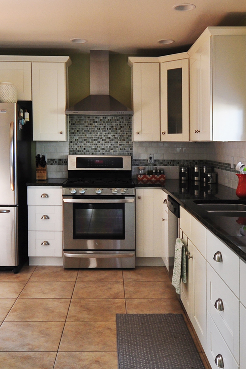 White kitchen cabinets with white subway tile