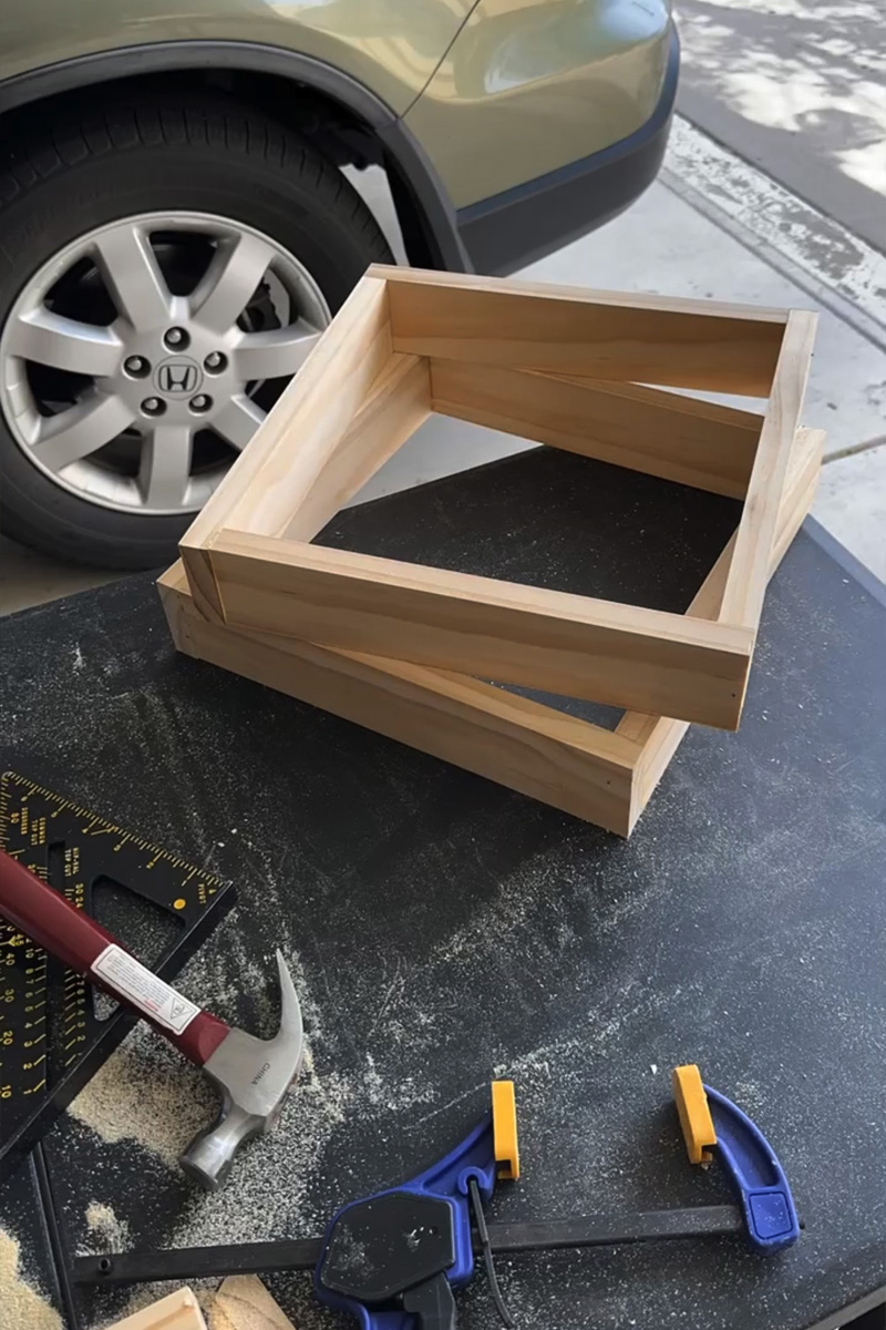 Two wooden square bases