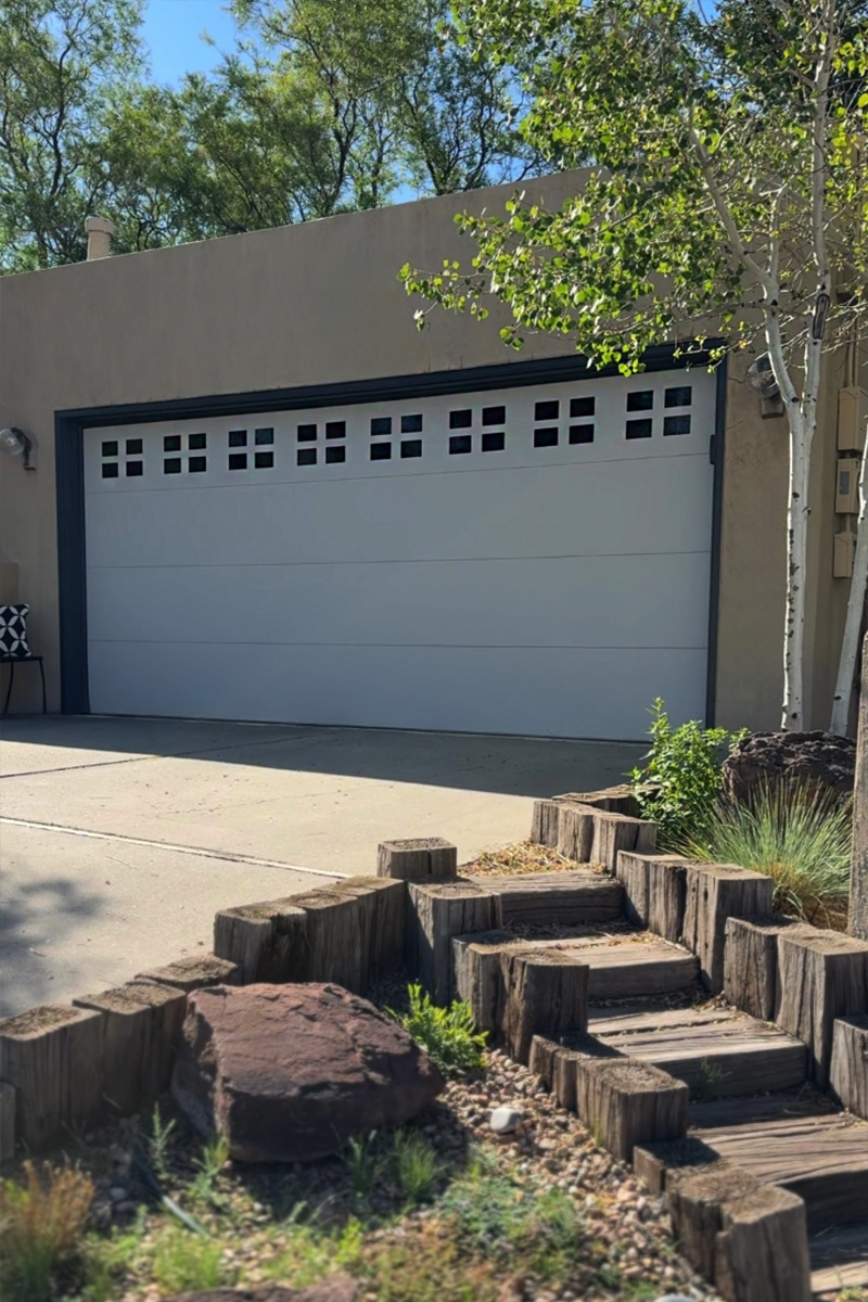 White garage door with black panel windows