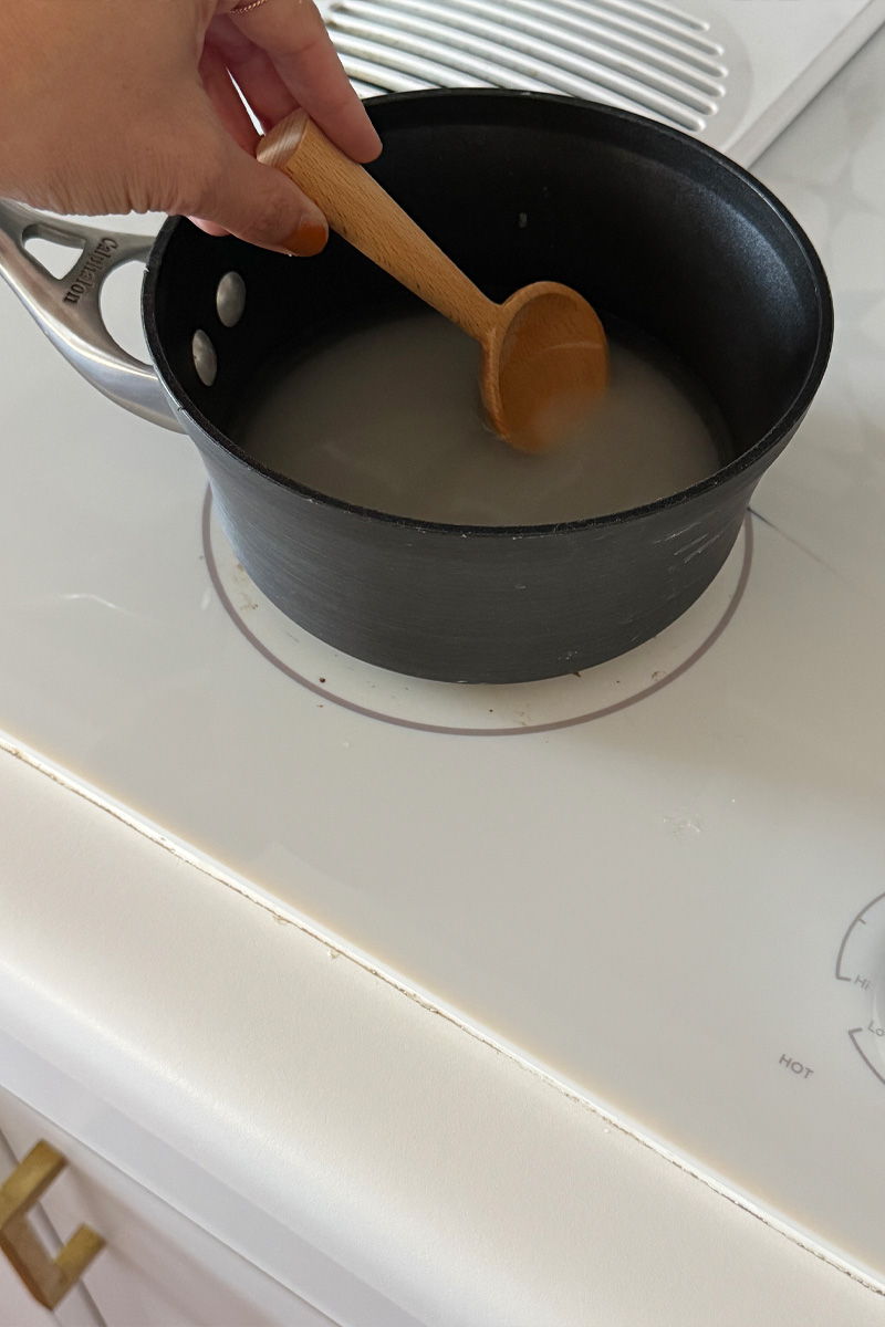 Small pot with water and sugar on the stovetop