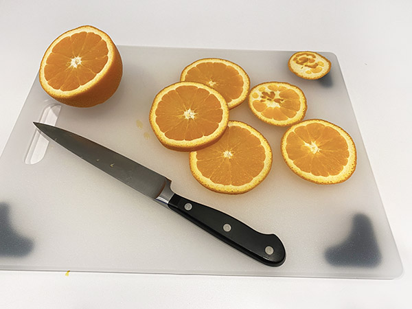 Oranges on a cutting board