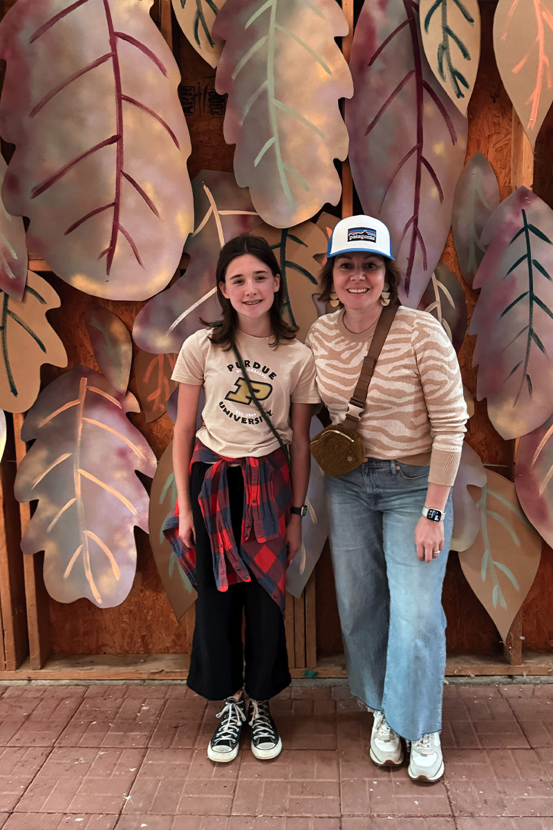 Two girls against a huge Leaf Backdrop