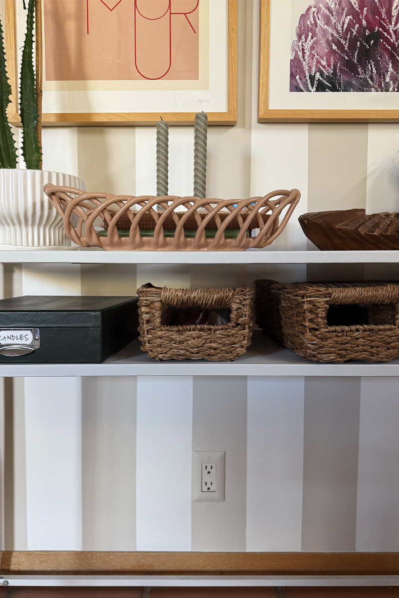 Cream and white striped wall with matching outlet cover