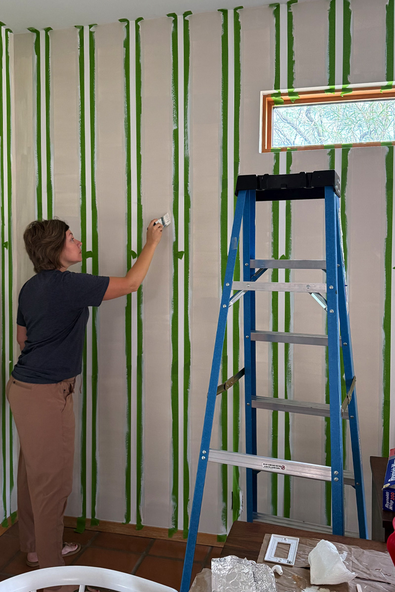 Painting edges of Warm Putty paint on stripes