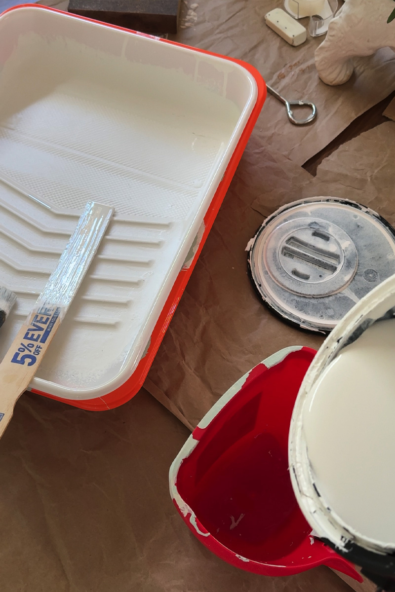 White paint and roller