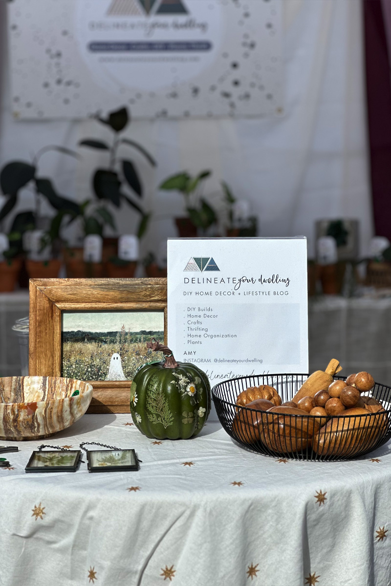 Delineate Your Dwelling signage at a Fall popup event