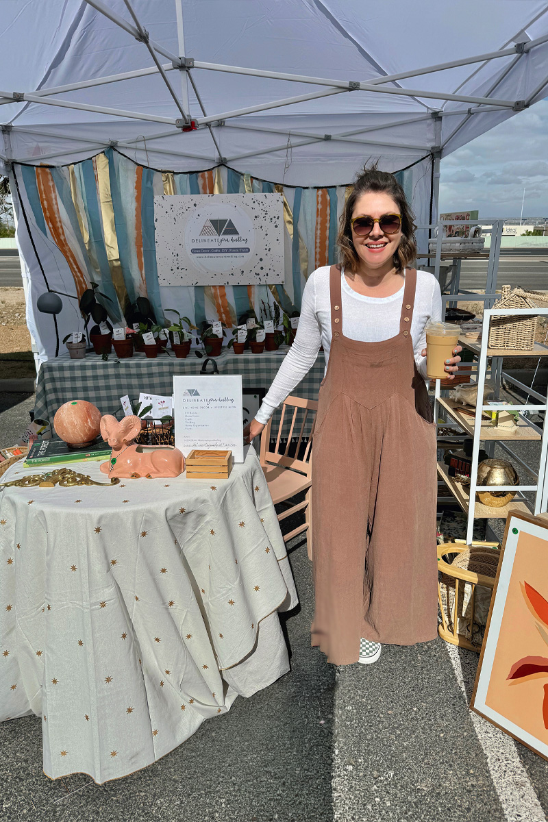 Woman in a Popup Booth holding coffee
