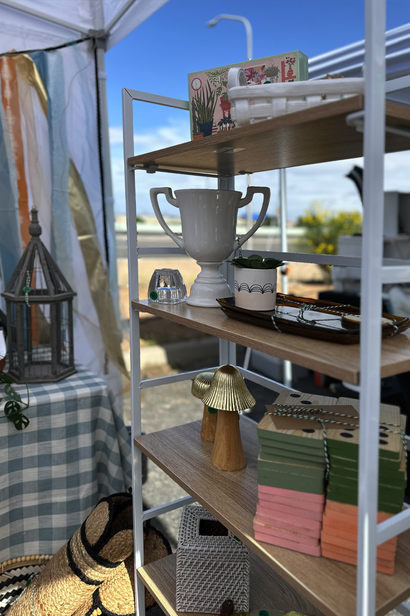 Home decor and craft items displayed on shelves at a Popup event