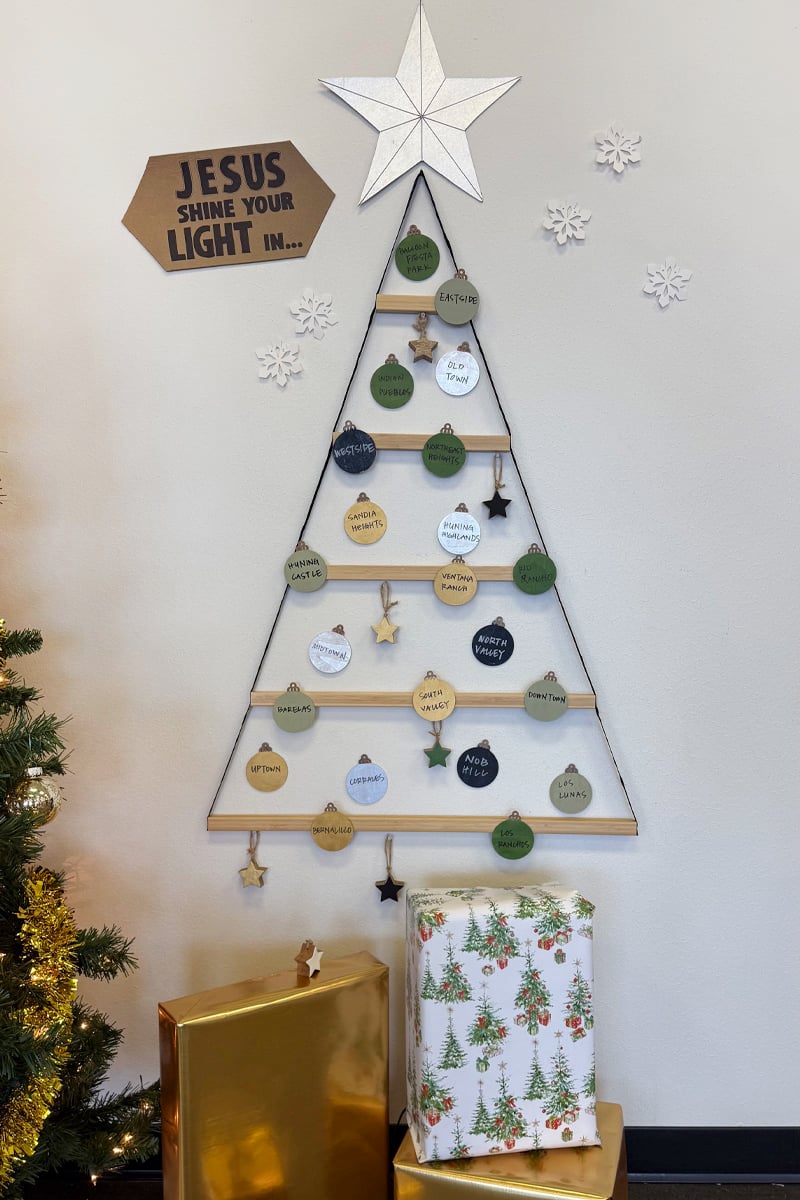 Christmas tree made of ribbon with round wooden ornaments