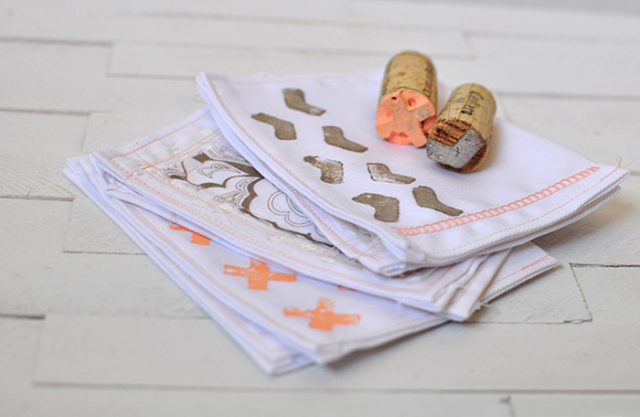 Corks dipped in paint to stamp cloth napkins